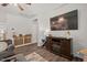 Comfortable living room featuring a large TV and seamless flow into the kitchen at 2730 Spring Valley Dr, Creedmoor, NC 27522