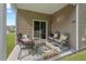 Covered patio with cushioned seating and a view of the yard and landscape at 2730 Spring Valley Dr, Creedmoor, NC 27522