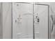 A pristine white shower with built-in shelving offers a convenient and clean bathing space with modern fixtures at 2730 Spring Valley Dr, Creedmoor, NC 27522