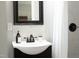Bathroom vanity with sleek black hardware and bright natural light at 2801 E Shoreham St, Durham, NC 27707