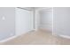 Bright bedroom with plush carpet, closet, and gray painted walls offers a modern, cozy feel at 2801 E Shoreham St, Durham, NC 27707