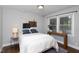 Relaxing bedroom featuring natural light and a warm, cozy ambiance at 2801 E Shoreham St, Durham, NC 27707