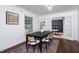 Bright dining room with stylish chairs and a large window at 2801 E Shoreham St, Durham, NC 27707