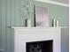 Elegant white fireplace mantel with decor creates a cozy, inviting atmosphere to the room at 2801 E Shoreham St, Durham, NC 27707
