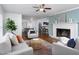 Bright and airy living room featuring a fireplace, hardwood floors, and an open layout at 2801 E Shoreham St, Durham, NC 27707