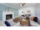 Cozy living area with fireplace, hardwood floors, comfortable seating, and modern decor at 2801 E Shoreham St, Durham, NC 27707