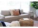 Close up of furniture in the living room with decorative pillows, rug, and a modern side table at 2801 E Shoreham St, Durham, NC 27707