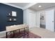 Office with desk, contrasting accent wall, and easy access to an adjacent room at 2801 E Shoreham St, Durham, NC 27707