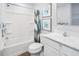 Bright bathroom showcasing a tub with shower, modern fixtures, and stylish decor at 290 Grand Silo Rd, Raleigh, NC 27603