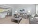 Cozy living room with plush sofas, stylish decor, and an open layout to the kitchen at 290 Grand Silo Rd, Raleigh, NC 27603