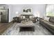 Comfortable living room with contemporary furnishings, neutral colors, and bright natural light at 290 Grand Silo Rd, Raleigh, NC 27603