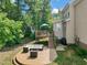 Patio and deck with lush greenery provides ample space for outdoor enjoyment at 2925 Dargan Hills Dr, Wake Forest, NC 27587
