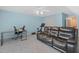 Cozy basement offers a comfortable living space with modern workstation and exercise equipment at 2925 Dargan Hills Dr, Wake Forest, NC 27587