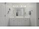 Bathroom with a double vanity, large mirror, and ample cabinet space at 2925 Dargan Hills Dr, Wake Forest, NC 27587
