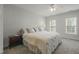 Bright bedroom with a ceiling fan, carpet, and natural light from two windows at 2925 Dargan Hills Dr, Wake Forest, NC 27587