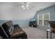 Bright bedroom featuring a modern ceiling fan, ample natural light, and comfortable seating at 2925 Dargan Hills Dr, Wake Forest, NC 27587