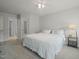 Spacious bedroom featuring carpet, a ceiling fan, and ensuite bathroom access at 2925 Dargan Hills Dr, Wake Forest, NC 27587
