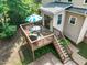 Elevated deck with grill and dining set, offering a perfect spot for outdoor relaxation at 2925 Dargan Hills Dr, Wake Forest, NC 27587