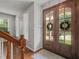 Bright entryway featuring a wooden front door with glass panes and hardwood floors at 2925 Dargan Hills Dr, Wake Forest, NC 27587