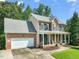 Traditional two-story house with brick and siding, an attached garage, and a well-kept lawn at 2925 Dargan Hills Dr, Wake Forest, NC 27587