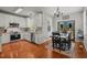 Kitchen and dining area with stainless steel appliances, white cabinets, and access to an outdoor space at 2925 Dargan Hills Dr, Wake Forest, NC 27587