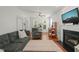 Bright and airy living room featuring hardwood floors, fireplace, and neutral decor at 2925 Dargan Hills Dr, Wake Forest, NC 27587