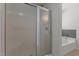 Clean bathroom with glass door shower and soaker tub at 296 Gordon Farm Dr, Benson, NC 27504