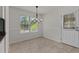 Cozy dining area featuring neutral walls, tile floors, and a window providing natural light at 296 Gordon Farm Dr, Benson, NC 27504