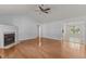 Bright and airy living room with hardwood floors, a fireplace, and ample natural light at 296 Gordon Farm Dr, Benson, NC 27504