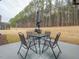 Outdoor patio with seating area, perfect for al fresco dining and enjoying the expansive backyard with mature trees at 301 Porter Hill Dr, Youngsville, NC 27596