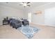 Bright and airy bedroom boasting two cozy chairs, a decorative blue rug, and elegant decor at 301 Porter Hill Dr, Youngsville, NC 27596