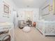 Cozy Bedroom with a crib, rocking chair, and decorative accents, creating a soothing environment for the little one at 301 Porter Hill Dr, Youngsville, NC 27596