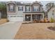 Charming two-story home with manicured lawn, two-car garage and inviting front porch at 301 Porter Hill Dr, Youngsville, NC 27596