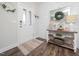Welcoming foyer with shiplap accent wall and hardwood floors at 301 Porter Hill Dr, Youngsville, NC 27596