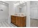Spa-like bathroom with double vanity, chevron-patterned cabinetry, and modern fixtures at 3032 Dixon Rd, Durham, NC 27707