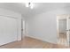 Bright bedroom with hardwood floors, a large closet, and a neutral color palette at 3032 Dixon Rd, Durham, NC 27707