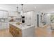 Gourmet kitchen featuring custom cabinets, stainless steel appliances, and stylish marble countertops at 3032 Dixon Rd, Durham, NC 27707