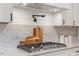 Gourmet kitchen featuring gas range, pot filler, marble backsplash, and modern white cabinetry at 3032 Dixon Rd, Durham, NC 27707