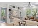 Cozy seating area with a custom built-in bookcase and a large window overlooking the backyard at 3032 Dixon Rd, Durham, NC 27707