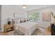 Serene main bedroom featuring a large window and an en suite bathroom at 3032 Dixon Rd, Durham, NC 27707