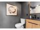 Stylish powder room with a unique vanity, gold accents, and modern fixtures at 3032 Dixon Rd, Durham, NC 27707