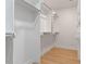 Walk-in closet with custom shelving and hardwood floors at 3032 Dixon Rd, Durham, NC 27707
