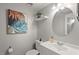 Bathroom with a round mirror, gray walls, and modern decor at 3086 Colony Rd # C, Durham, NC 27705