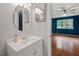 Bathroom with a round mirror and access to bedroom at 3086 Colony Rd # C, Durham, NC 27705