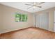 Bright bedroom features natural light, ceiling fan, and hardwood flooring at 3086 Colony Rd # C, Durham, NC 27705