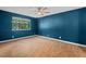 Bedroom with a ceiling fan and a window overlooking the trees at 3086 Colony Rd # C, Durham, NC 27705