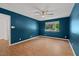 Bedroom with a ceiling fan, natural light, and a view of wooded outdoors at 3086 Colony Rd # C, Durham, NC 27705