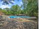 A beautiful community pool surrounded by lounge chairs and trees, offering a relaxing outdoor space at 3086 Colony Rd # C, Durham, NC 27705
