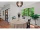 Dining area with large window letting in natural light and wooded view at 3086 Colony Rd # C, Durham, NC 27705