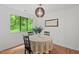 Dining area with nature painting, decor, and view of wooded outdoors at 3086 Colony Rd # C, Durham, NC 27705